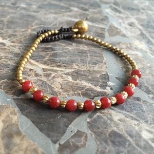 Hand woven beaded boho bracelet with brass bell
